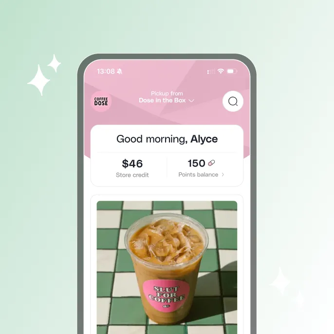 Mobile app screen greeting user Alyce with $46 store credit and 150 points, showing an iced coffee with a pink sticker on a green and white tiled table.