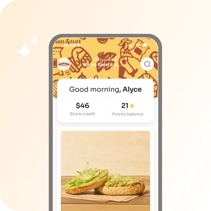 Mobile app screen showing a bagel with avocado spread and shredded lettuce, with user store credit of $46 and 21 points balance.